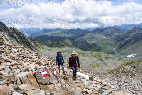 Red and white trail markings, hiker in the high mountains, Lasörling High Trail, Lasörling High Trail, Austria, Europe
