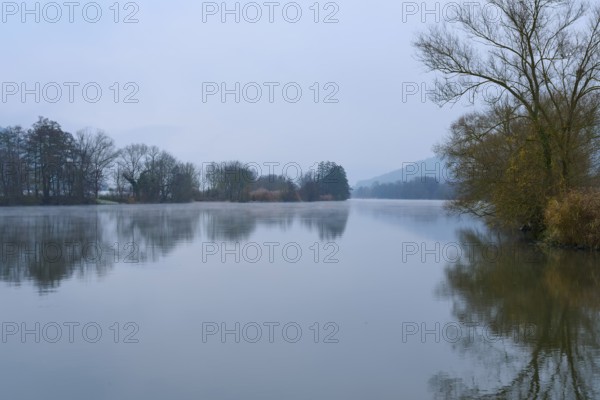 Quiet, misty landscape with a river, framed by trees and hills, Laudenbach, Main, Spessart, Odenwald, Bavaria Germany