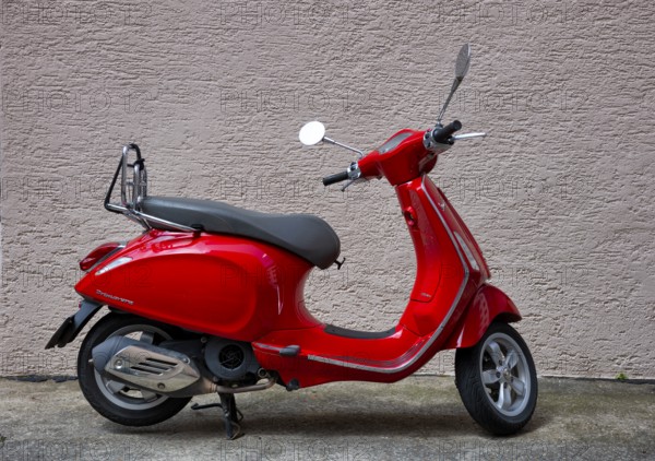 Motor scooter, scooter, Vespa Primavera 125, red, parked, in front of house wall, Stuttgart, Baden-Württemberg, Germany, Europe