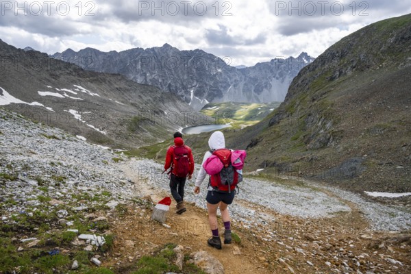Hikers in front of the Neue Reichenberger Hütte, Hohe Tauern, Austria, Europe