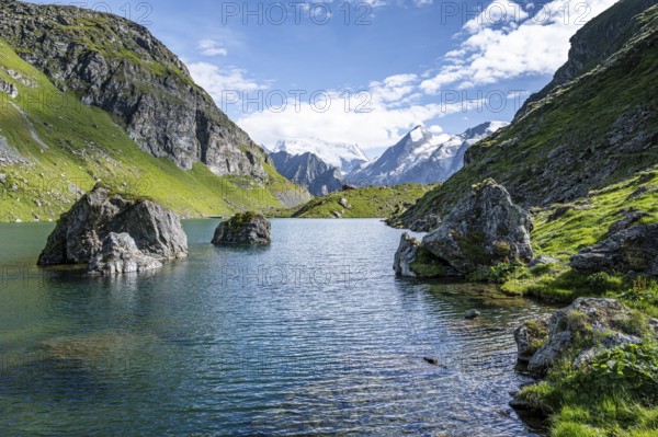 Mountain lake with view of glaciated mountain peaks, Lac du Louvie with summit Grand Combine, Valais Alps, Val de Bagnes, Valais, Switzerland, Europe