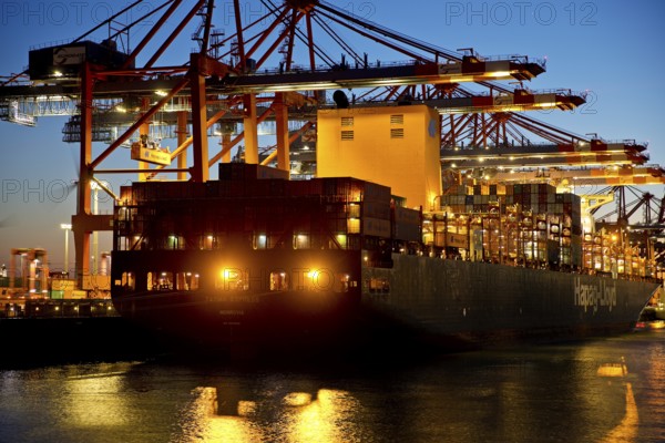 Container ships at the Eurogate container terminal in the evening with an atmospheric sunset, harbour, Hamburg, Germany, Europe