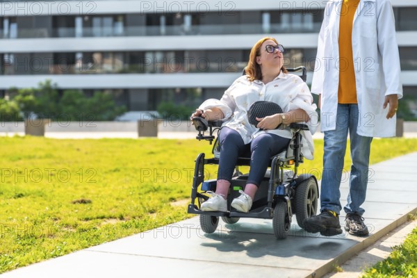 Doctor assisting a patient in a wheelchair, enjoying a sunny day in a city park, promoting inclusivity and accessible healthcare