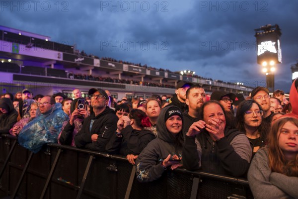 Festival visitors in front of the grandstand at the Rock am Ring Festival on Friday, Nürburgring race track race track, 07.06.2025