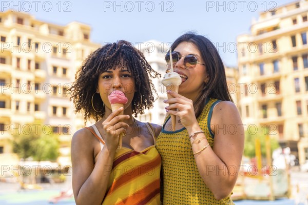 Two friends savoring delicious ice cream cones while enjoying a sunny summer day in downtown beirut, lebanon, radiating happiness together