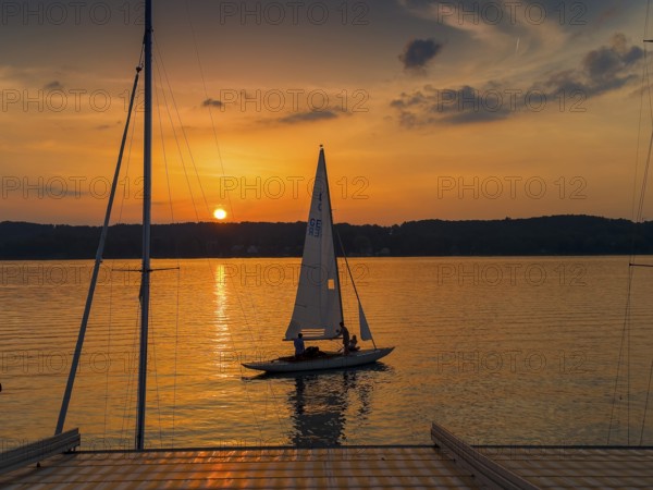 Sailing boat at sunset, Lake Starnberg, Bavaria, Germany, Europe