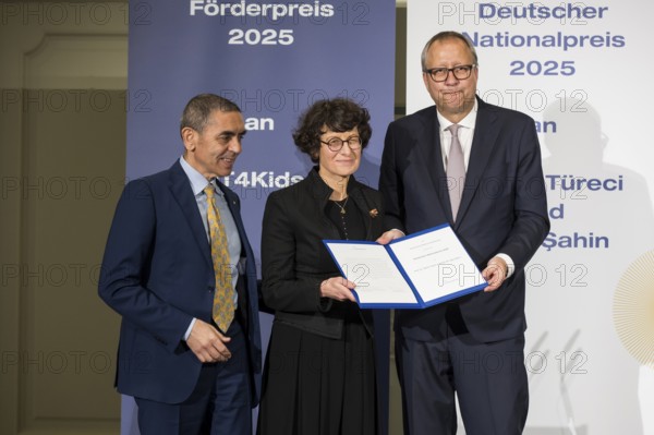 Ugur Sahin and Özlem Türeci (founders of Biontech SE) and Andreas Voßkuhle (President of the Senate of the German National Foundation) at the award ceremony for the German National Prize 2025 in the Französische Friedrichstadtkirche, Berlin, on 10 June 2025