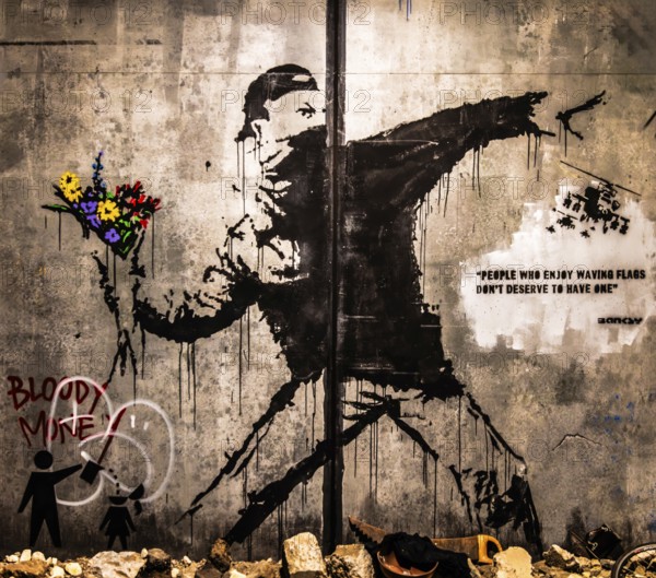 Banksy - Flower Thrower, revolutionary violence against pacifist fervour, 2003, exhibition The World of Banksy