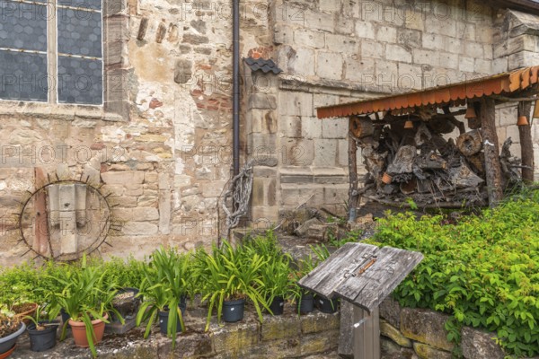 Church and bible garden of St Crucis Church, Bad Sooden, Allendorf, Allendorf district, art, potted flowers, fieldstone church, insects, wood, Werra-Meissner district, Hesse, Germany, Europe