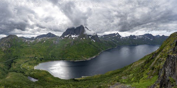 View of Mefjorden fjord from Barden mountain, Breidtind mountain peak behind, Senja, Norway, Europe