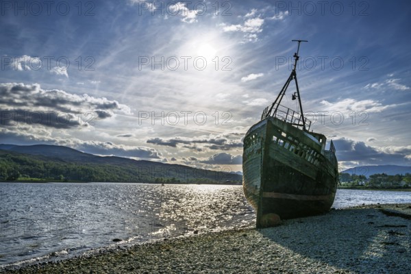Corpach Wreck or Old Boat of Caol and Nevis Range Mountains, Caol Beach, Corpach, Fort William, Highland, Scotland, UK