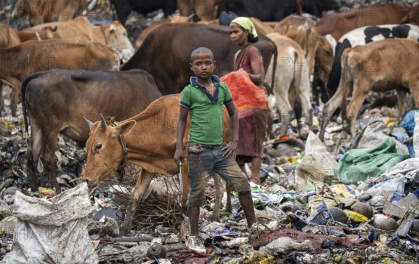Garbage collectors searching for recyclable material at garbage disposal site, in Assam, India on June 4, 2025. World Environment Day, celebrated every year on June 5, was established by the United Nations in 1972 to raise awareness and inspire action for protecting the environment. It highlights urgent issues like pollution, climate change, and biodiversity loss, encouraging individuals, communities, and governments to take steps toward a more sustainable future