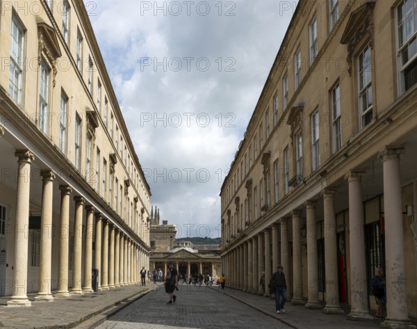 Georgian style buildings with colonnades, Bath Street, city of Bath, north east Somerset, England, UK