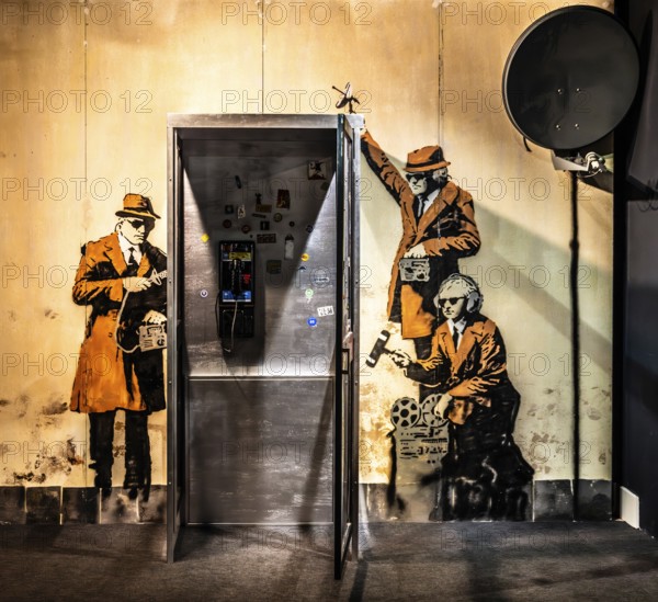 Banksy - Spy Booth, reference to state surveillance, 2014, Cheltenham, UK, exhibition The World of Banksy
