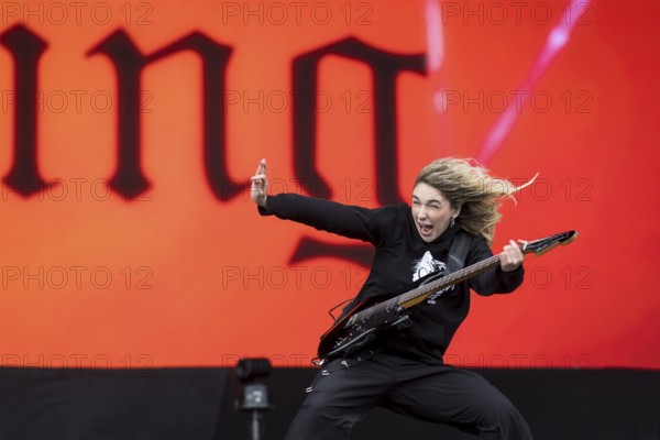 Daniela Villarreal Vélez, singer of The Warning is surprised by a gust of wind at the Rock am Ring Festival on Sunday, Nürburgring race track race track, 08.06.2025