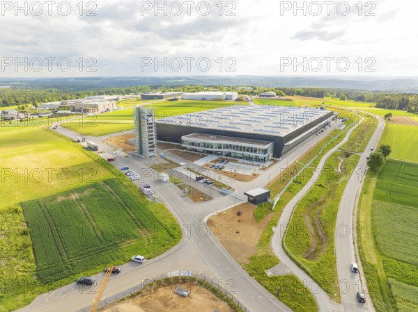 Large industrial building surrounded by fields and roads in a rural area, ING Park development area, Zweckverband INGpark Nagold Gäu, Nagold, Germany, Europe