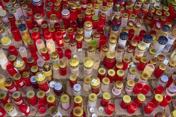 Many candles in different colours stand close together, creating a festive and contemplative atmosphere, cemetery, Mannheim, Baden-Württemberg, Germany, Europe