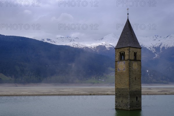 Bad weather at the church tower of Altgraun in Reschensee, Reschenpass, Vinschgau, South Tyrol, Italy, Europe