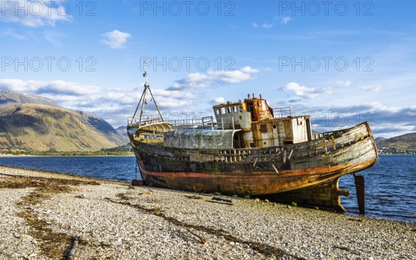 Corpach Wreck or Old Boat of Caol and Nevis Range Mountains, Caol Beach, Corpach, Fort William, Highland, Scotland, UK