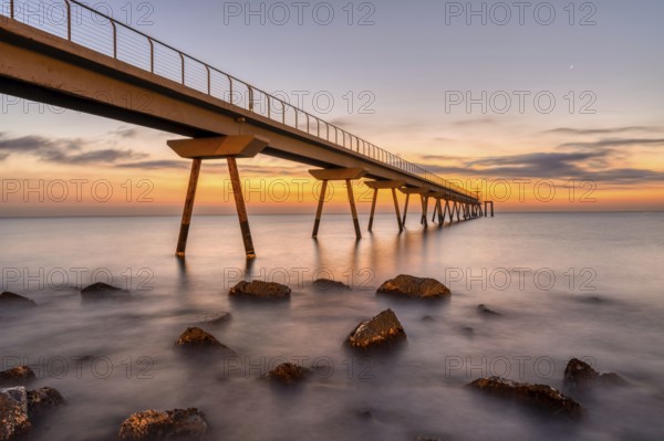 The pier of Badalona in Spain in front of sunrise