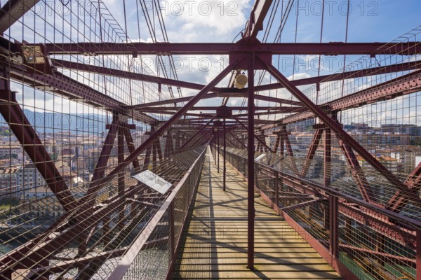 View along the gangway of the bridge. The Vizcaya Bridge, the worlds oldest transporter bridge, built in 1893, links the towns Portugalete and Las Arenas in the Basque Country, in the north of Spain