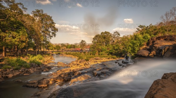 Long exposure of majestic Tad Lo waterfalls in Salavan province in southern Laos