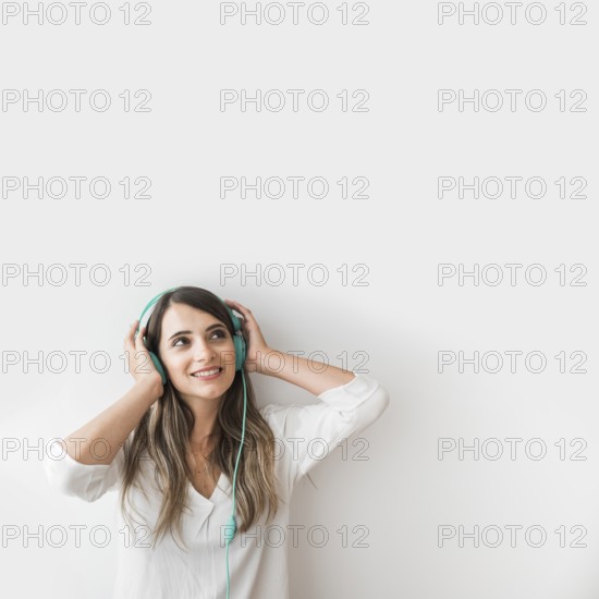 Happy woman dancing with earphones
