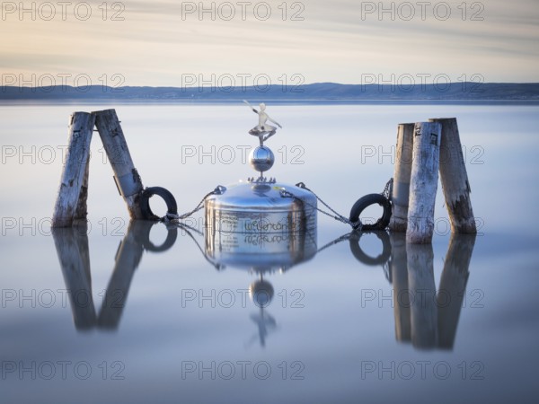 Device with wine swimming in a lake in Burgenland
