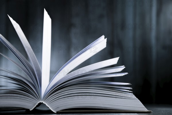 Composition with hardcover book on the table