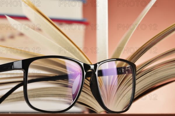 Composition with glasses and books on the table