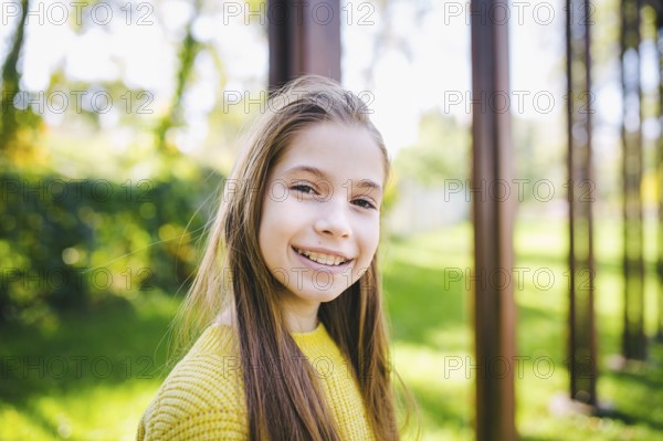 Beautiful teenage girl wearing braces smiling cheerfully dressed in bright yellow clothes outdoors. Cute and happy teenage girl with braces smiling to camera. Alignment biting teeth, correct teeth biting