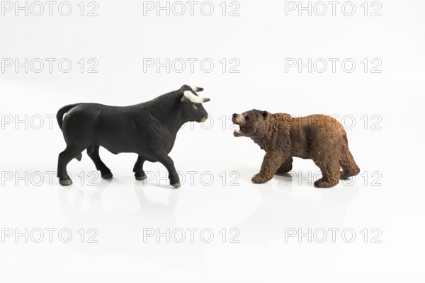 Stock market, securities trading and capitalism concept with a bull and bear concepts. On white background for cutout and copy space