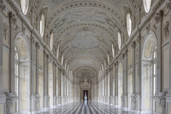 Elongated, elegant Baroque corridor with marble decorations, Palace of Venaria Reale, Residences of the House of Savoy, Turin, Piedmont, Italy, Europe