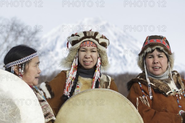 KAMCHATKA PENINSULA, RUSSIA, FEB 5, 2012: Womens dressed in the Koryak national costume with tambourines. Public concert Koryak National Folk Dance Group. Eurasia, Russian Far East, Kamchatka Region