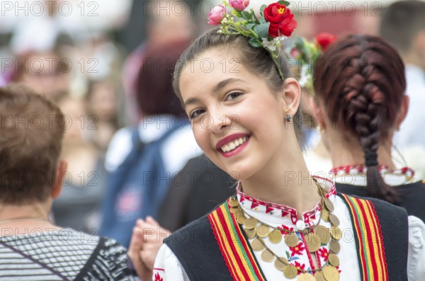 Traditional women's clothing. A young woman in Bulgarian folk costume