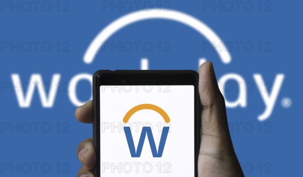 Workday logo is displayed on smartphone. Workday is a cloud-based software company offering financial, HR, and student management solutions