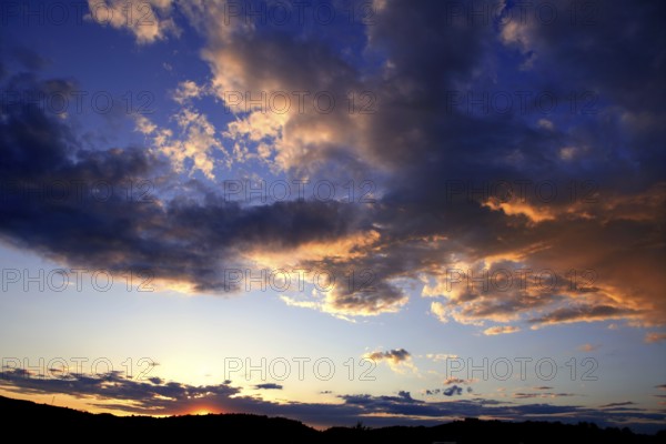 Blue red sunset sky background stormy clouds
