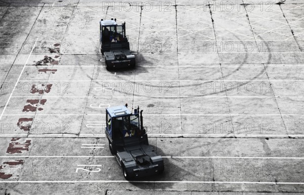 Loading lorry tractors in the port of Newcastle after work in the car park in front of the ferry