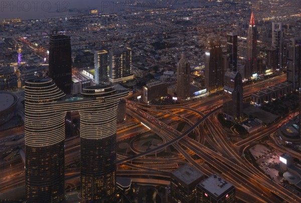 A picture of the Address Sky View Hotel and the busy Al Safa Street and Sheikh Zayed road intersection at night