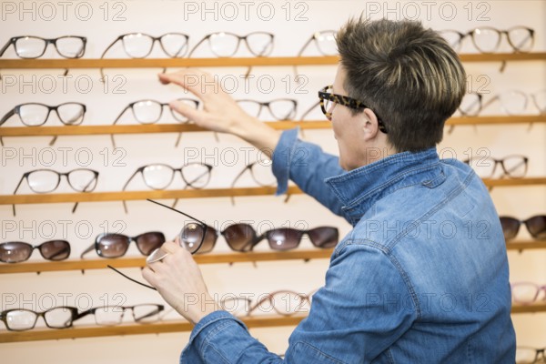 An image of a woman in a eyewear store