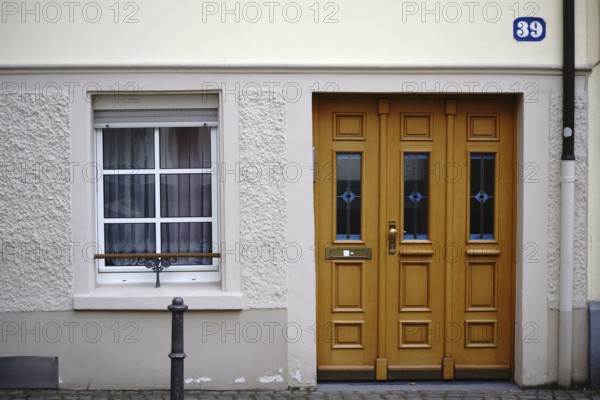 The entrance to an old town flat with very low ceilings and a window