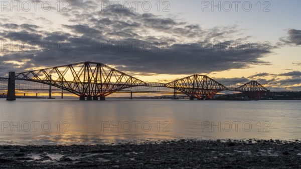 Evening atmosphere at the Forth Bridge, seen from South Queensferry, City of Edinburgh, Scotland, UK
