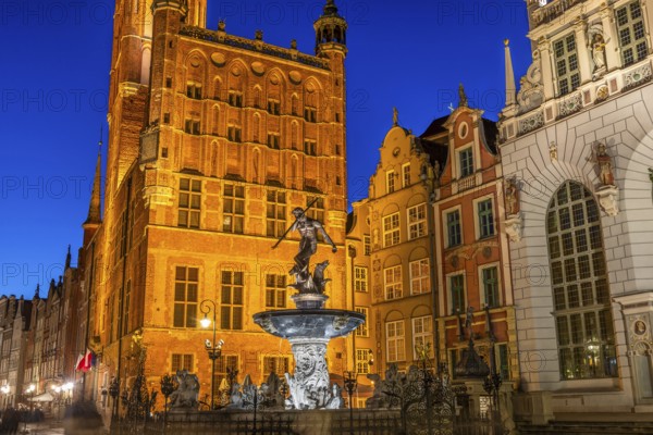 Fountain of Neptune in Gdansk illuminated in evening, Poland, Europe