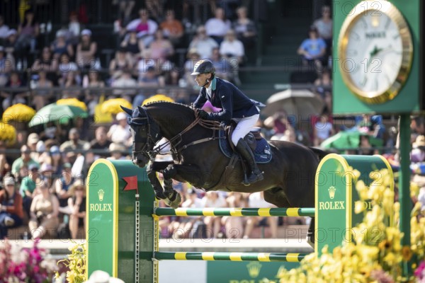 Denis Lynch of Ireland and riding Vistogrand compete in the first round of the 1.60m CPKC International during the Spruce Meadows Masters, presented by Rolex, in Calgary, Alberta, Canada, North America