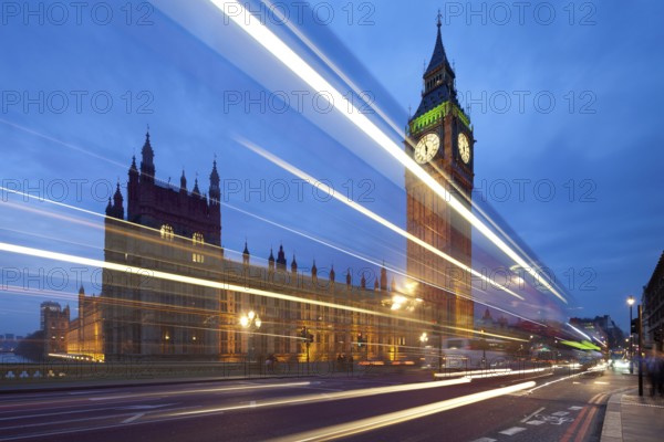 Big Ben in the evening. Dabldekker passes and leaves a line of light at slow shutter speeds. Cityscape shot with tilt-shift lens maintaining verticals