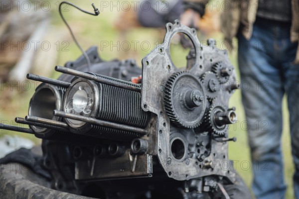 View of mechanical parts of an engine being repaired outside