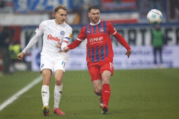 Football, Bundesliga 1, Matchday 26, 2024/2025, 1. FC Heidenheim vs. Holstein Kiel, 16/03/2025, Voith-Arena, Heidenheim, Germany, Timo BECKER (Holstein Kiel, 17) in duel with Budu ZIVZIVADZE (1. FC Heidenheim, 12), Europe