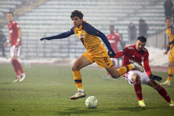 Sofia, Bulgaria - 9 December, 2021: Player of CSKA Sofia in action against Gonzalo Villar (L) of AS Roma during the UEFA Europa Conference League group C soccer match between CSKA Sofia and AS Roma