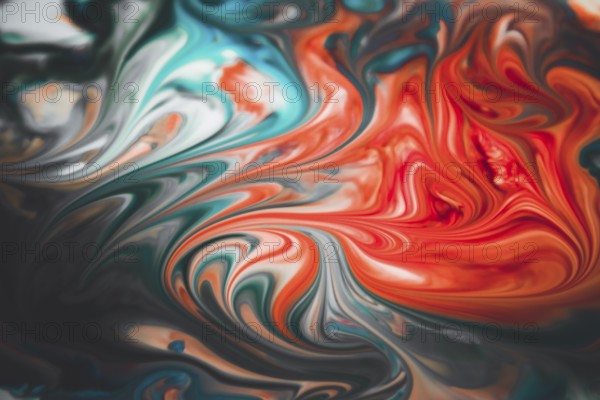 Colorful liquid paints mixed together creating modern abstract