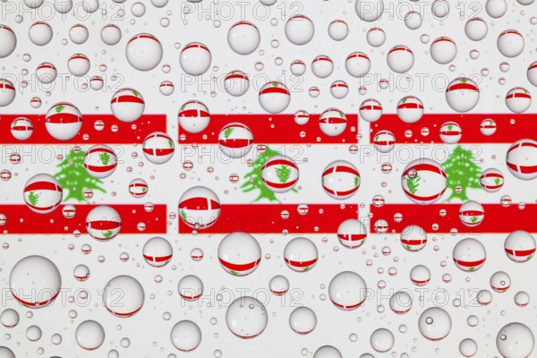 Flags of Lebanon behind a glass covered with raindrops. 3D illustration